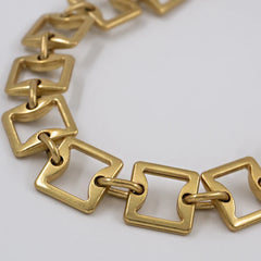Gilt square chain waist belt with brass tassel in old gold