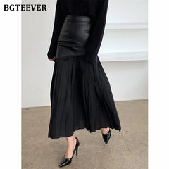 A-line mid-length pleated skirt in PU leather patchwork with high waist