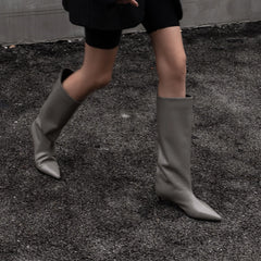Pointed toe knee-high boot with kitten heel in cowhide