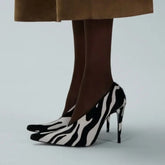 Pointed toe stiletto pump in zebra print suede