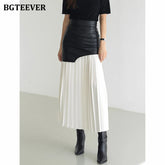 A-line mid-length pleated skirt in PU leather patchwork with high waist