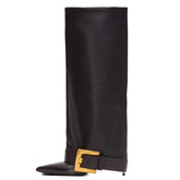 Pointed toe knee-high boot with thin high heel and belt buckle