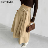 A-line long striped skirt with lace-up and irregular hem