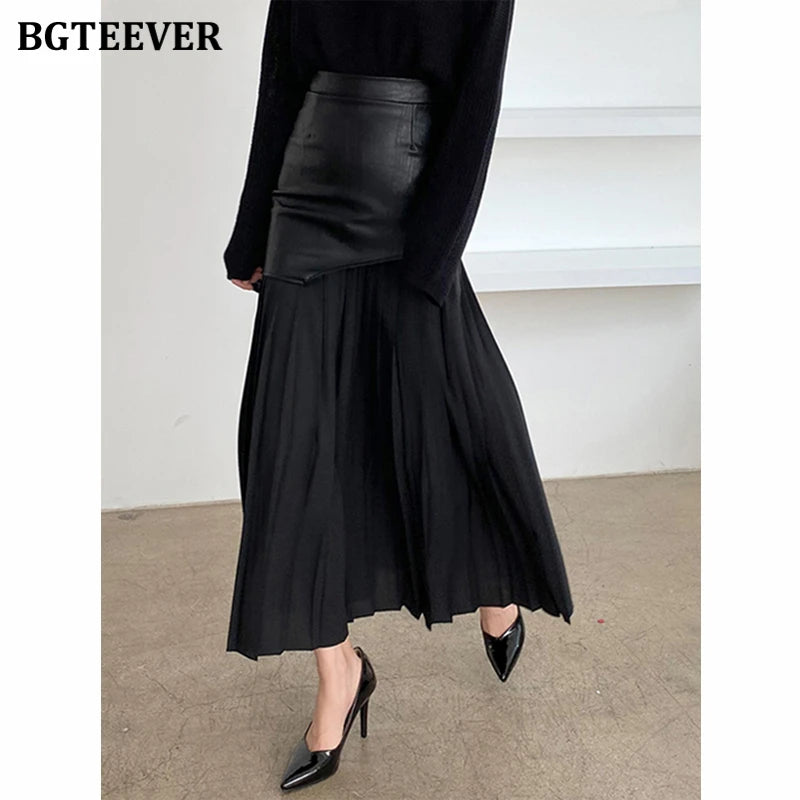 A-line mid-length pleated skirt in PU leather patchwork with high waist