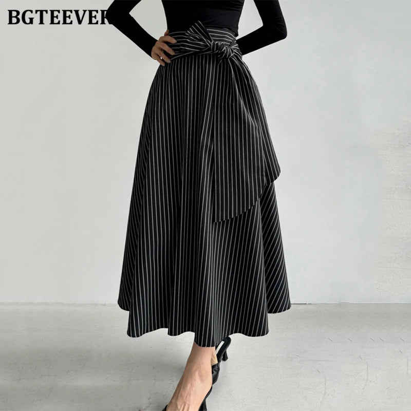 A-line long striped skirt with lace-up and irregular hem