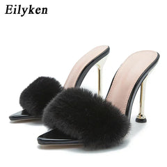 Pointed toe stiletto mule with fluffy fur detail