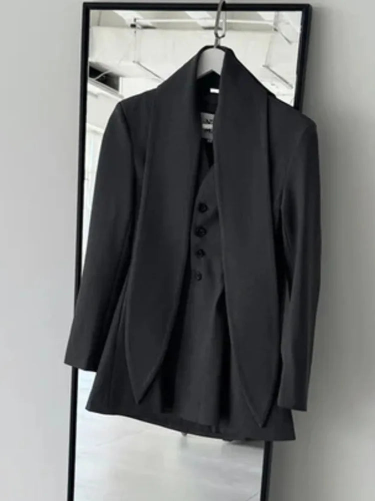 Asymmetric draped collar peplum blazer with structured shoulder in ivory