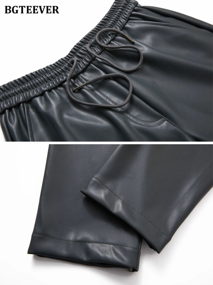 Elastic waist straight faux leather trousers with drawstring