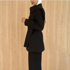 Asymmetric draped collar peplum blazer with structured shoulder in black
