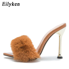 Pointed toe stiletto mule with fluffy fur detail