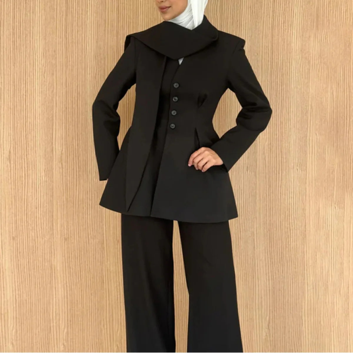 Asymmetric draped collar peplum blazer with structured shoulder in black