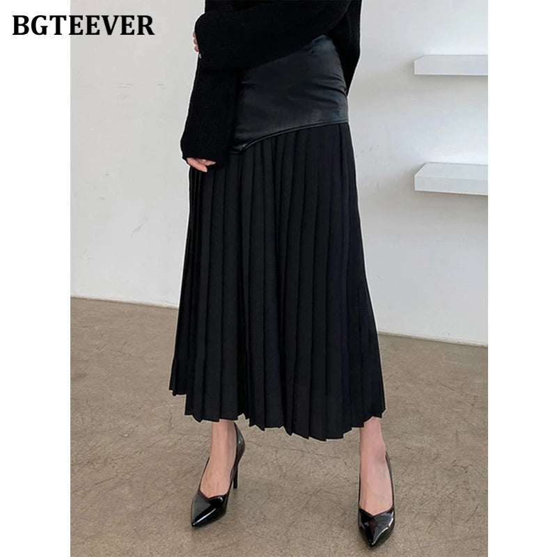 A-line mid-length pleated skirt in PU leather patchwork with high waist