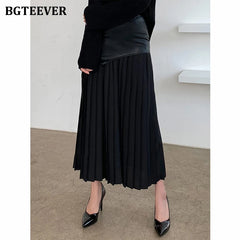 A-line mid-length pleated skirt in PU leather patchwork with high waist