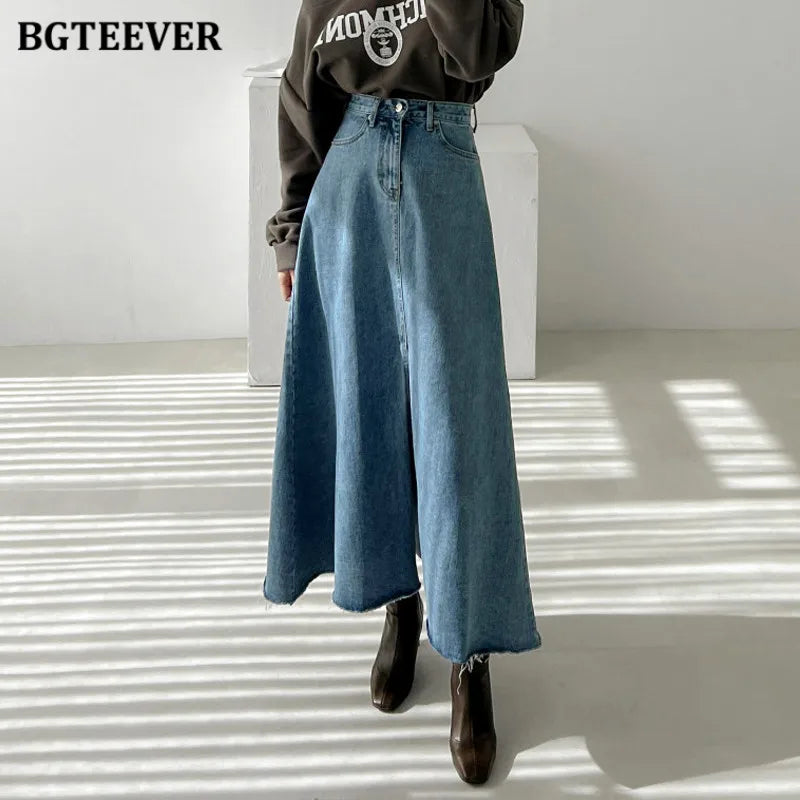 A-line denim skirt with pockets, high waist, and split hem