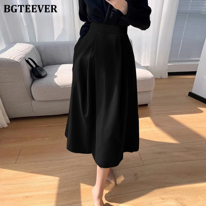 A-line mid-length split skirt with pockets and high waist