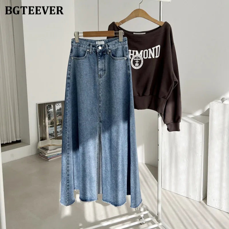 A-line denim skirt with pockets, high waist, and split hem