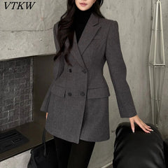 Dark brown double-breasted blazer with button cuff in textured fabric