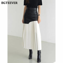 A-line mid-length pleated skirt in PU leather patchwork with high waist