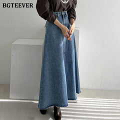 A-line denim skirt with pockets, high waist, and split hem