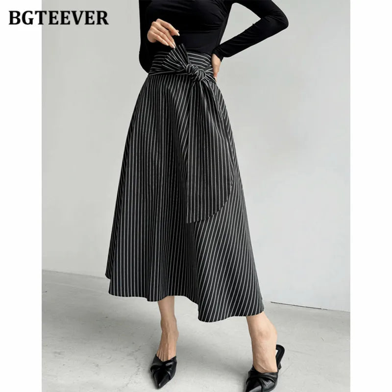 A-line long striped skirt with lace-up and irregular hem
