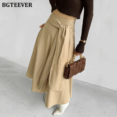 A-line long striped skirt with lace-up and irregular hem