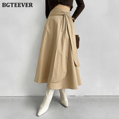 A-line long striped skirt with lace-up and irregular hem